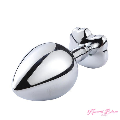 Side profile of the polished metal Hello Kitty anal plug, showing its smooth, ergonomic teardrop shape for comfortable wear.
