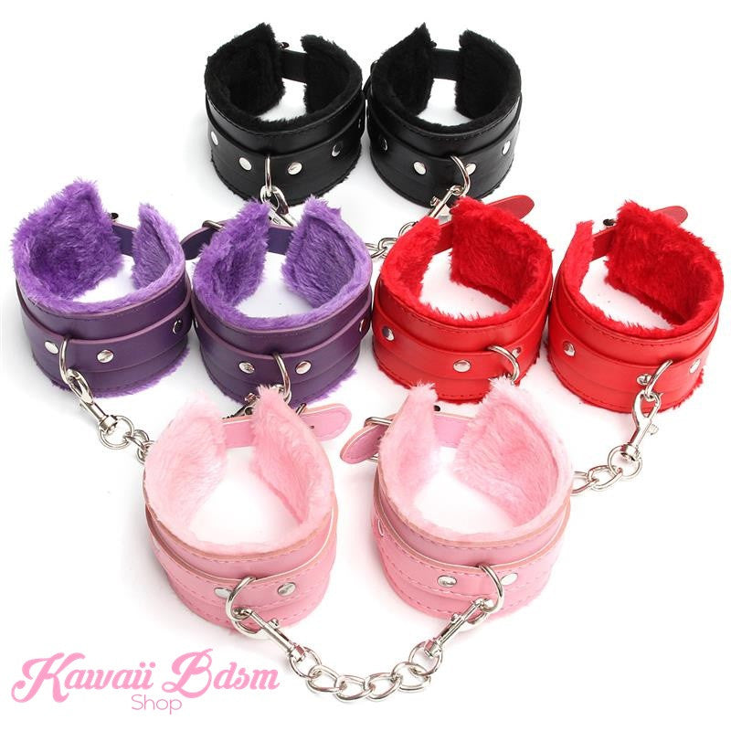 Four pairs of fluffy faux leather cuffs arranged together in purple, black, red, and pastel pink, beautifully showcasing the vibrant vegan fur lining inside.