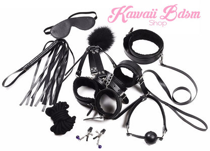 Overhead shot of the full black bondage kit, showcasing the sturdy silver metal hardware and buckles.