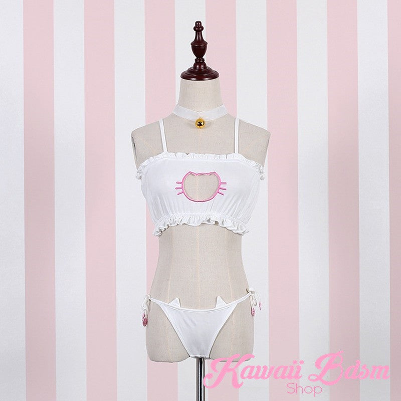 White kawaii neko lingerie set displayed on a dress form mannequin against a pink striped background, providing a clear view of how the cat cutout bra and tie-side panties fit and accentuate a natural body shape.