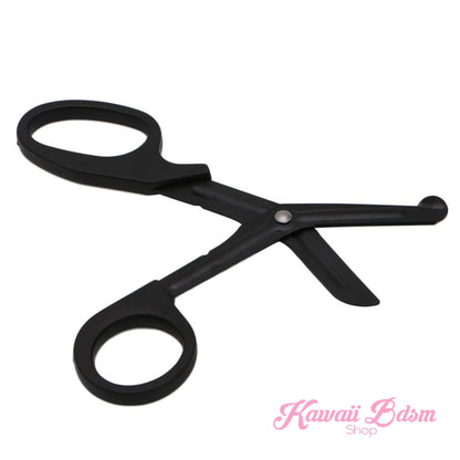 Black medical-grade safety shears slightly open, perfectly showcasing the blunt-nosed safety tip used to protect the skin during rope removal.