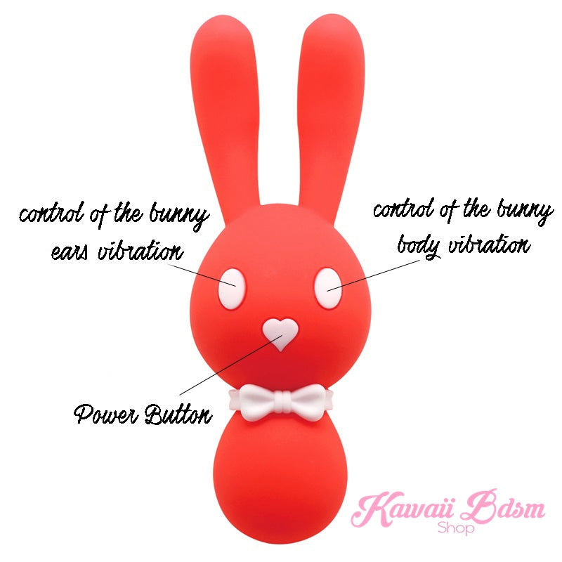 A bright orange Mitzi bunny wand vibrator with white ear tips and a white bow tie, clearly showing the three front control buttons