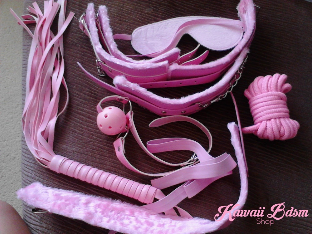 Real view of the pink bondage kit items showing the vibrant color and soft textures of the set.