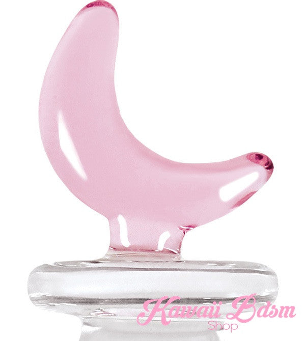 Close-up detail of the pastel pink glass crescent moon handle of the pleasure wand.