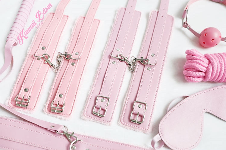 Close-up of the pink padded hand and ankle cuffs with sturdy silver metal clips for secure play.