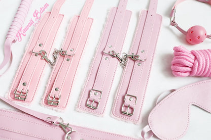 Close-up of the pink padded hand and ankle cuffs with sturdy silver metal clips for secure play.