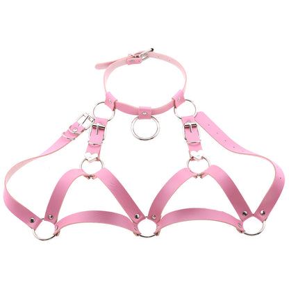 Pastel pink kawaii chest harness in vegan leather, fully adjustable for alternative fashion styles.