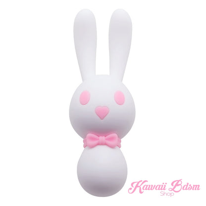 A cute, kawaii-style bunny vibrator named Mitzi, featuring a smooth white silicone body, little pink cheeks, and a pastel pink bow tie on a clean white background.